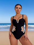 2026 New Women's One-Piece Swimsuit: Solid Black, Deep V-Neck, White Floral Cutout Side Detail, Sweetheart Neckline, Chic Beach Style